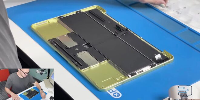 macbook neo teardown modular ports glue less battery zero tape index